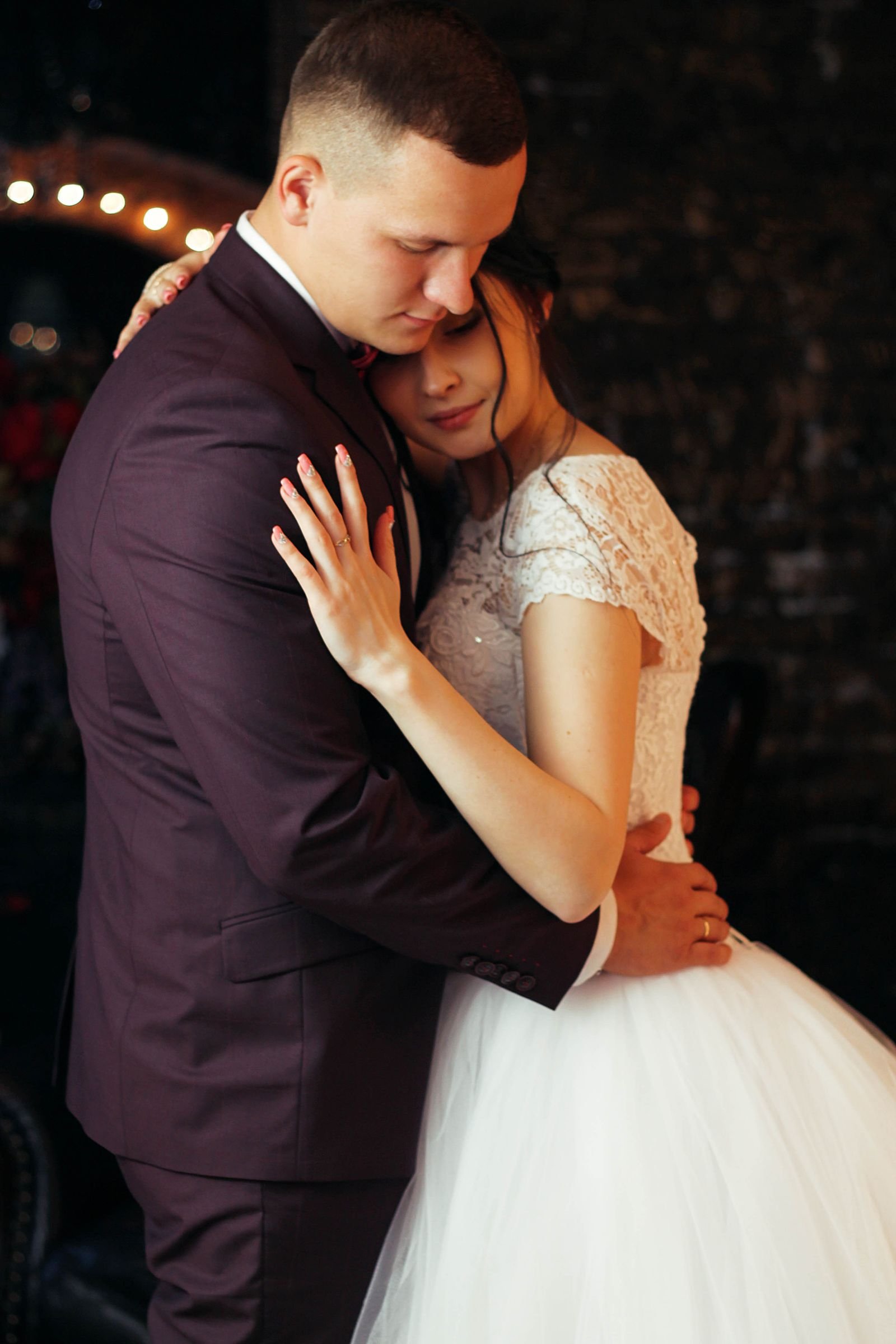 The first dance under warm string lights